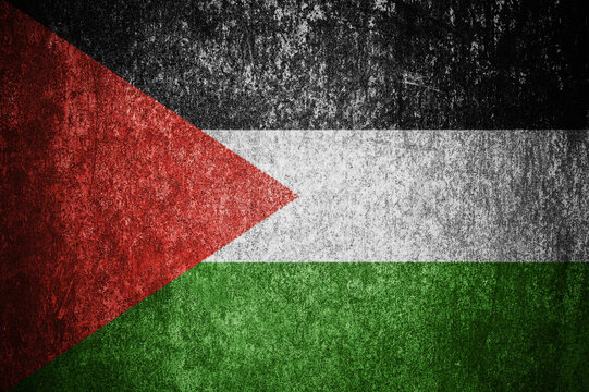 Closeup of grunge Palestinian flag. Dirty Palestine flag on a metal surface