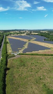 Vertical drone footage of solar panels in the suburbs of England, UK