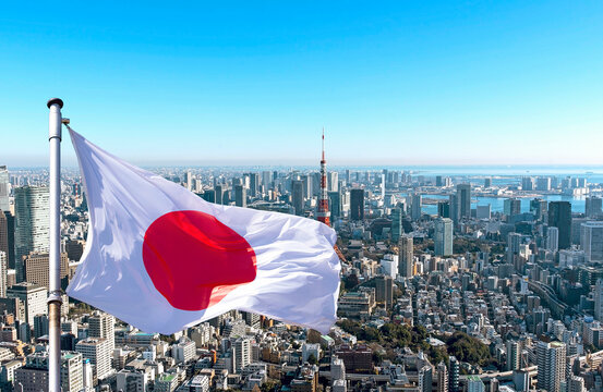 Panoramic view of Tokyo and Japanese flag, Japan.