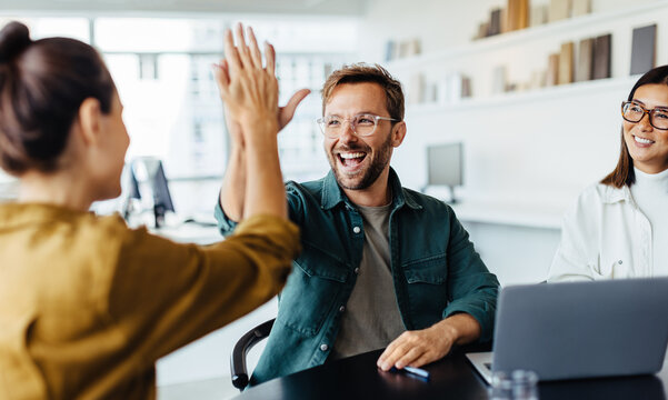 Business people celebrating success in an office