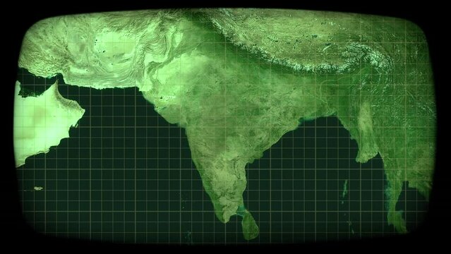 Viewing on a CRT monitor (green phosphors): satellite capture of India, and zooming out. Surveillance, global communications.
