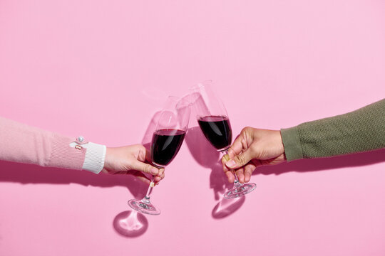 Close up cropped photo of female, male hold in hands glass