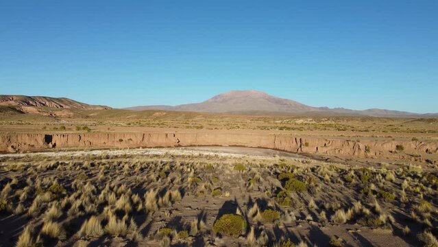 4k drone footage of the alpine desert and a river in the Bolivian Andes