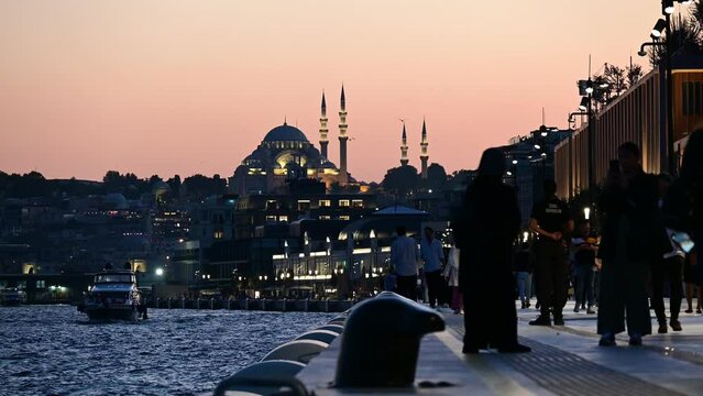 Ortakoy at night with illuminated Hagia Sofia in the background