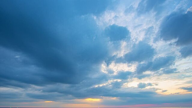 .Time lapse stunning clouds float above the sea as the sun sets..scenery The beauty of the sky was mesmerizing in stunning sunset.Gradient color..Sky texture, abstract nature background.