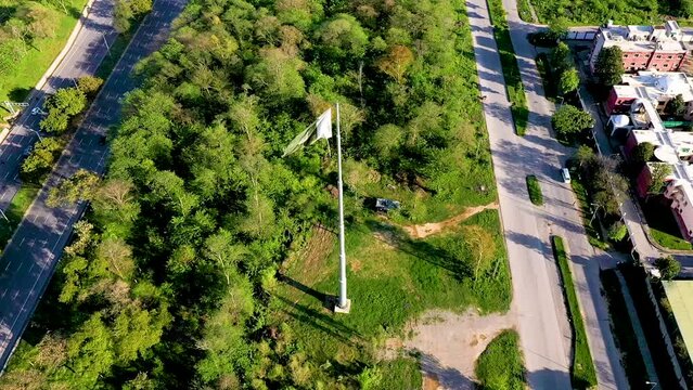 National flag of Islamic republic of Pakistan. waving Pakistani flag. Pakistan, Islamabad October 23, 2023. Aerial drone view