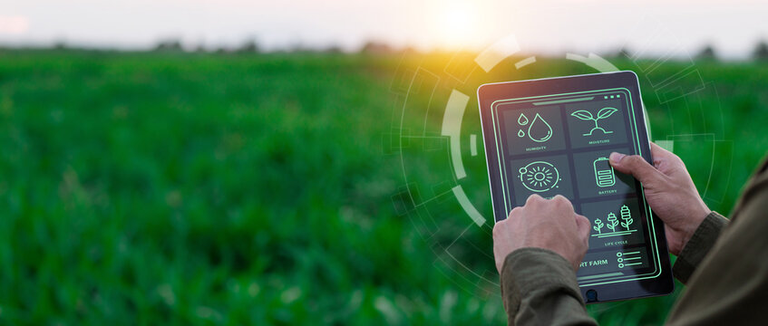 Farmers use agricultural technology in data analysis tablets and image icons. New technologies in agricultural business concepts. Men use tablets to research and develop plant varieties, agricultural 