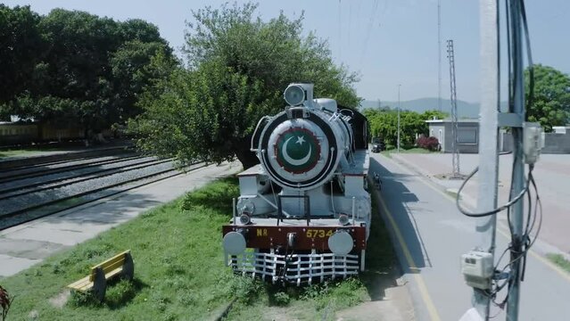 Old Train with Pakistan Flag stant in Islamabad Railway as a show piece. Railway station. 