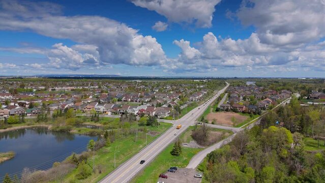 Aerial footage of a structured community over a lush landscape.