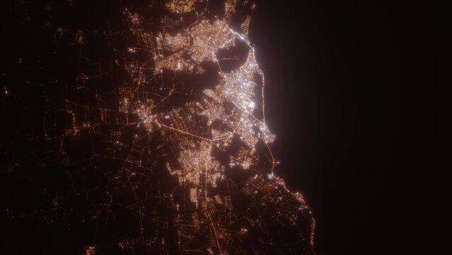 Natal (Brazil) aerial view at night. Satellite view on modern city with street lights. Camera is flying above the city, moving forward