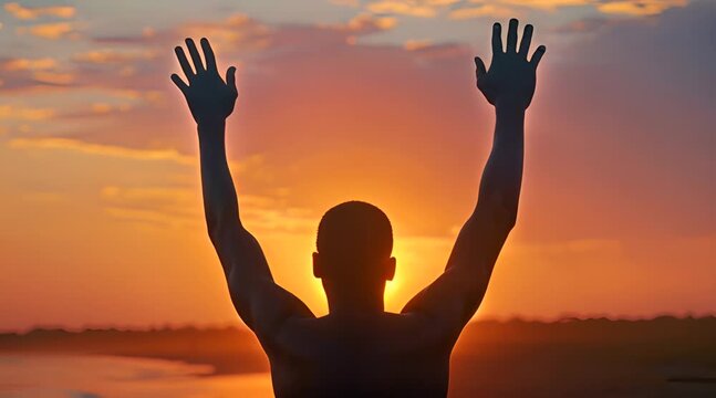 Man raising hands to sky against sunset footage