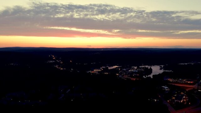 Beautiful twilight sky over a small rural town. Aerial 4k drone stock video