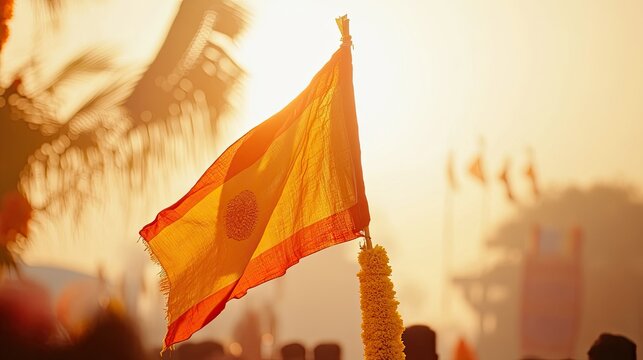 A close-up of the Gudi flag being hoisted during a celebration of Gudi Padwa, with cultural elements in the background.