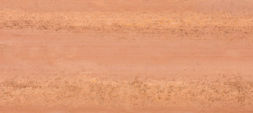 brown wet surface of country road