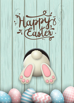 Easter motive, bunny bottom and easter eggs in fresh grass on blue wooden background, illustration