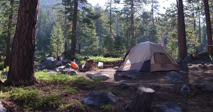 4k Family camping in a remote location dolly shot.