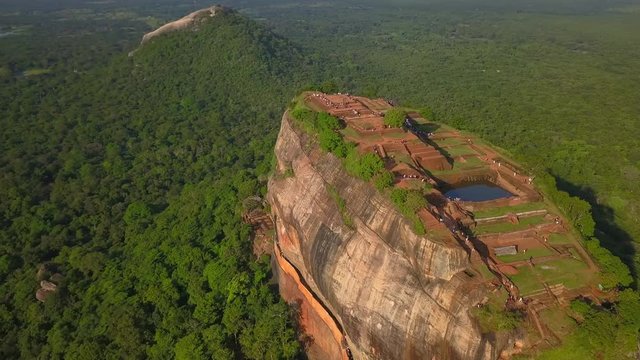 Amazing aerial view of Sigiriya rock at sundown Sri Lanka drone footage