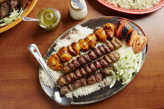 Overhead view of food served in plate on wooden table