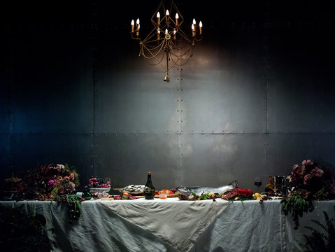 Long table with food and flowers