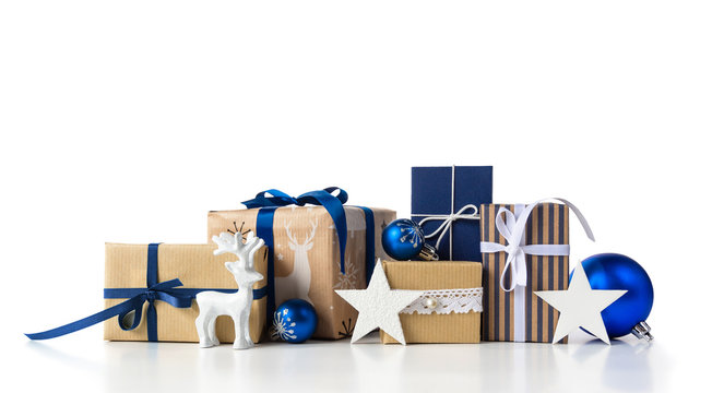 Gift boxes and christmas blue balls on white.