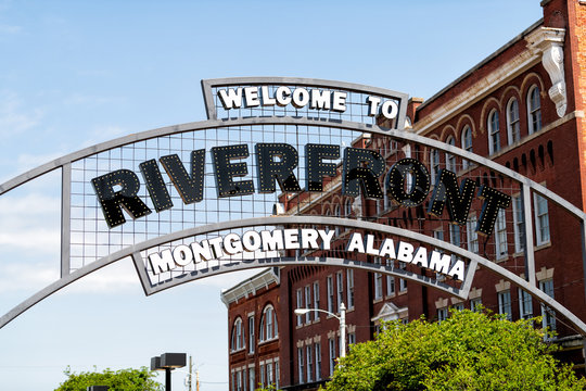 Welcome to Riverfront park illuminated sign with buildings in background in capital Alabama city of Montgomery in old town