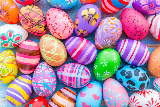 Beautiful colorful easter eggs on blue wooden