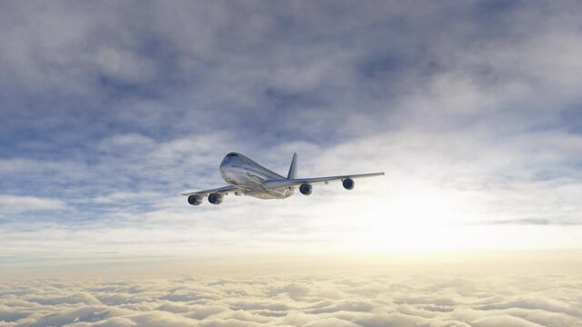 Big jet airplane flying over the sky in beautiful sunrise light. Aerial view of plane above the clouds. Footage in 4K, 16 bit depth