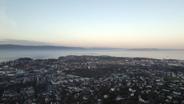 Aerial footage of the city of Trondheim, Norway during golden hour.