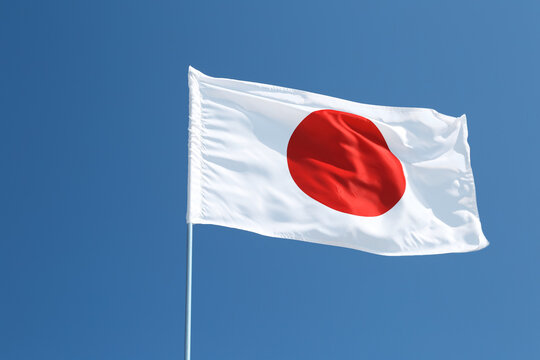 Waving flag of Japan outdoors