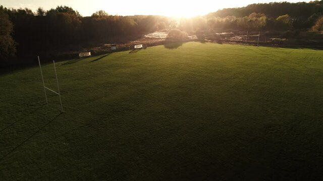 Empty rugby field in the autumn sunset