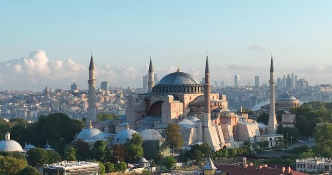 Istanbul, Turkey. Sultanahmet with the Blue Mosque and the Hagia Sophia with a Golden Horn on the background at sunrise. Cinematic Aerial view.