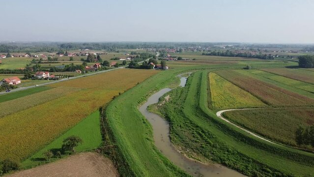 Aerial drone footage of agricultural lawns and fields