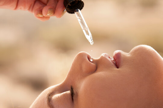 Ayurvedic Marma demonstrated by a senior practitioner on a female client. Photography on a white background. 