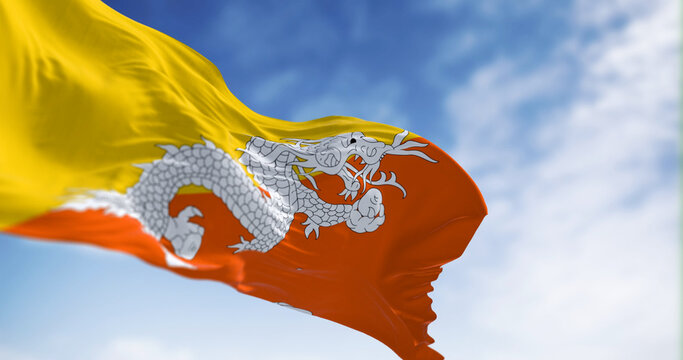 National flag of Bhutan waving in the wind on a clear day