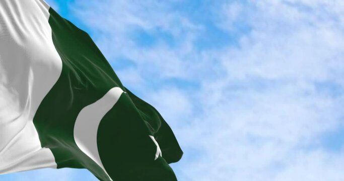 Close-up of Pakistan National flag waving on a clear day