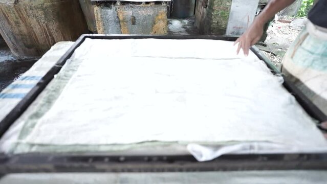 cutting tofu before distribution. traditional tofu making