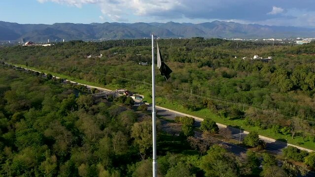 National flag of Islamic republic of Pakistan. waving Pakistani flag. Pakistan, Islamabad October 23, 2023. Aerial drone view