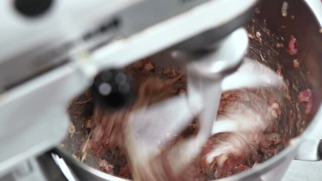 Close-up of preparing ground pork with a blender Focus on a specific point