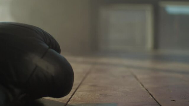 boxing gloves on the wooden floor in the gym