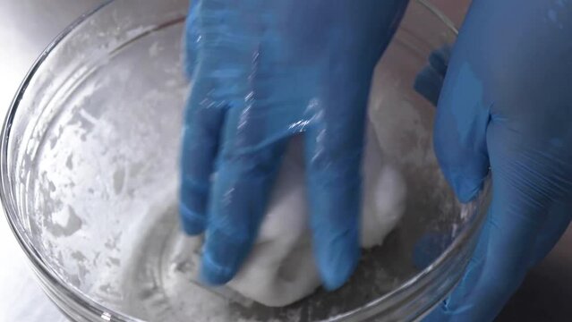 Hands making round dough to make Chinese dumplings