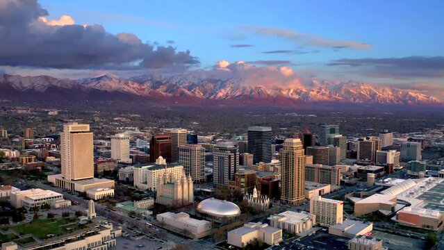 Aerial view of salt lake city skyline sunset view glow Salt Lake City skyline 4k Drone shot with the Wasatch Mountain in the background