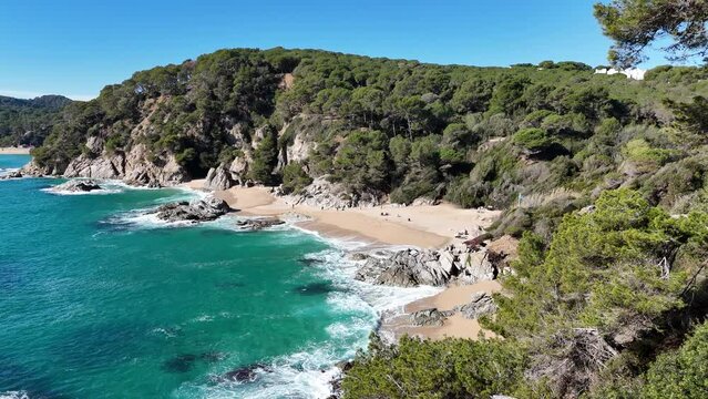 Drone footage of the beach "Sa Boadella" in Costa Brava, Girona, Spain.