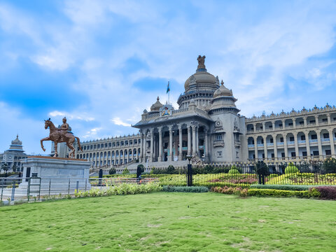 The Vidhana Soudha stands as a symbol of architectural splendor and political heritage under the watchful eyes of the monsoon sky.