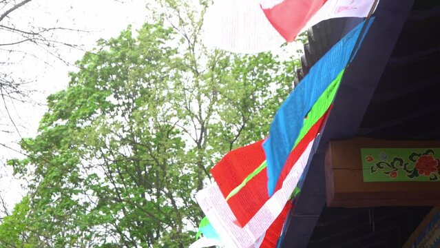 Tibetan colorful flags with prayers. Buddhism tradition. Tibet Prayer Flag.