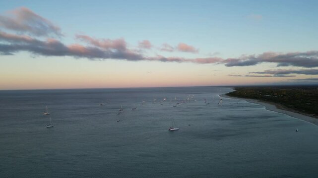 Sailing boats, sunset time, pink sky