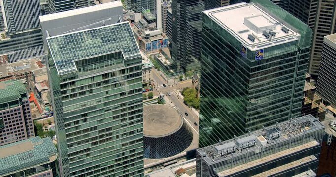 Aerial footage of Toronto at dawn, highlighting the skyscrapers and cityscape as the sun rises and casts a golden glow over the city Canada.