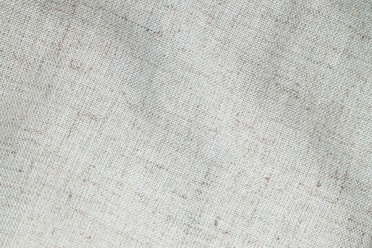 neutral white wavy textile fabric material textured background simple concept picture with empty copy space