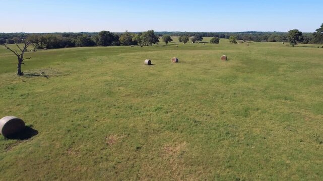 Drone footage of hay bales in a rural Oklahoma pasture