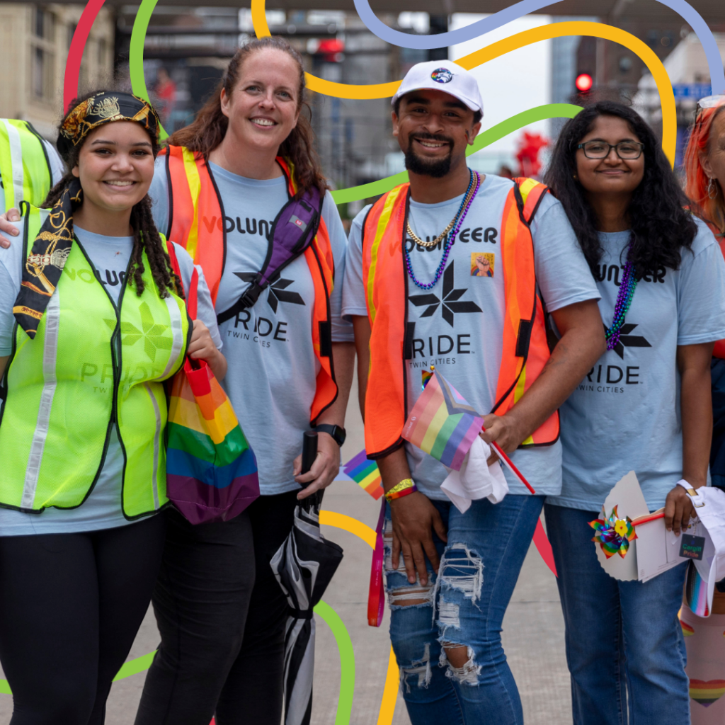 4 volunteers standing in the middle of the street wearing high visibility vests