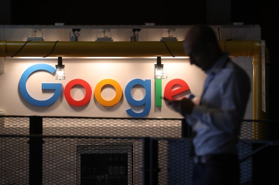 man in front of Google sign